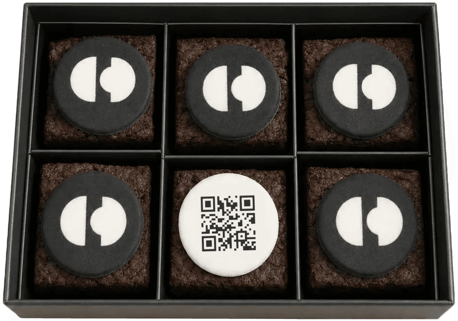 An open box of dark-chocolate fudge brownies, topped with sea salt